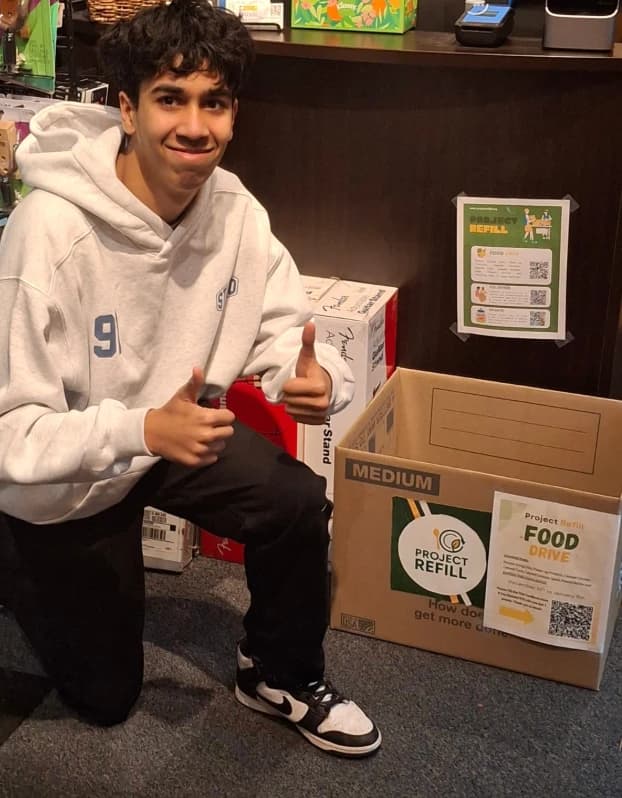 Team member at Moore Brothers Music donation box